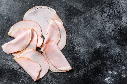 Preview: Slices of pork pastrami. Organic meat. Black background. Top view. Copy space