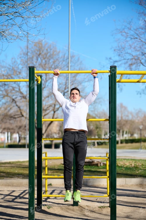 Preview: young boy exercising in a park