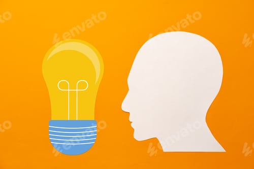 Preview: Papercut head and light bulb on paper background