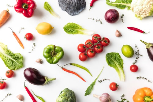 Preview: Top view of different unprocessed vegetables isolated on white