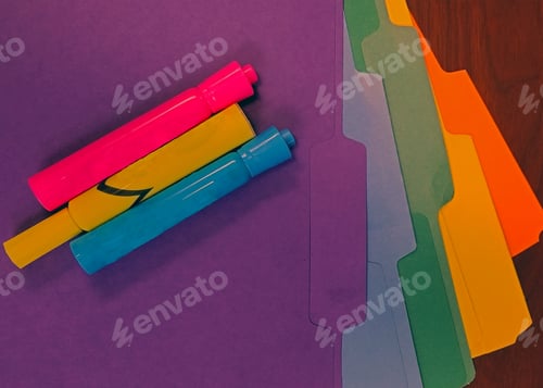 Preview: Background image of bright colored filing folders and highlighting markers.