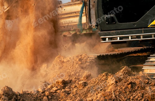 Preview: Close-up of excavator at construction site Backhoe digging soil for earthwork and construction