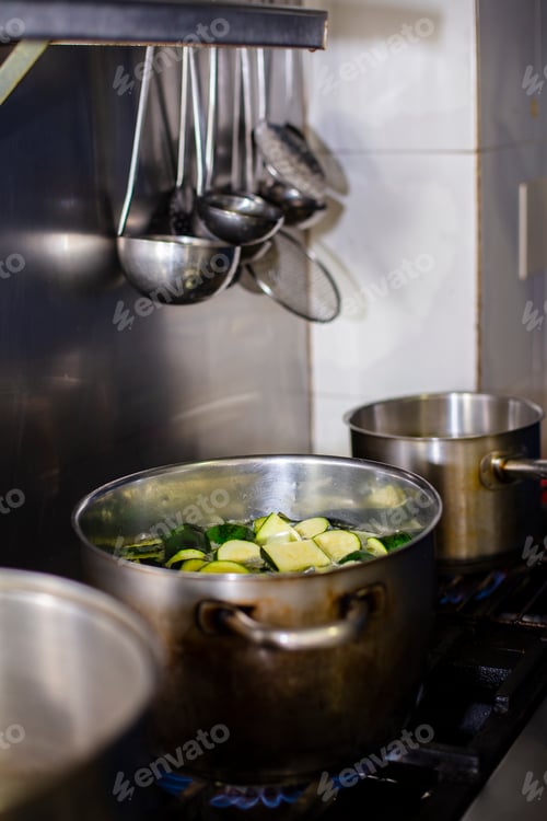 Preview: Boiling pot of zucchini for the preparation of a zucchini cream in a restaurant kitchen.
