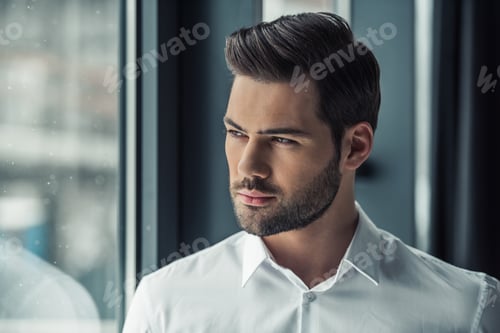 Preview: Handsome businessman in office