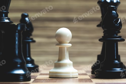Preview: White pawn stands alone on chessboard surrounded by black pieces during game play