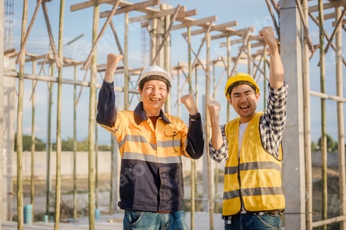 Preview: An elderly engineer and a middle-aged man at a construction site are discussing plans