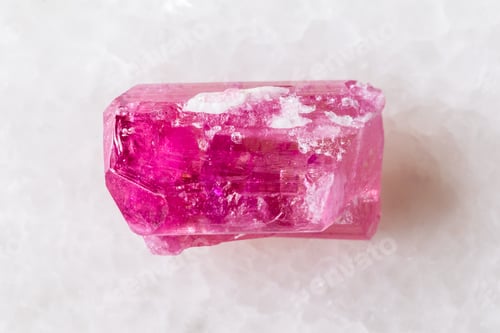 Preview: sample of raw rubellite crystal on white marble
