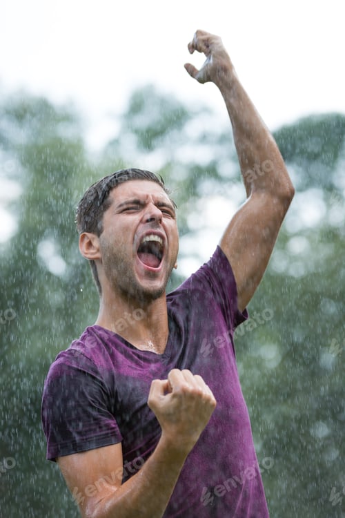 Preview: Excited man in summer rain