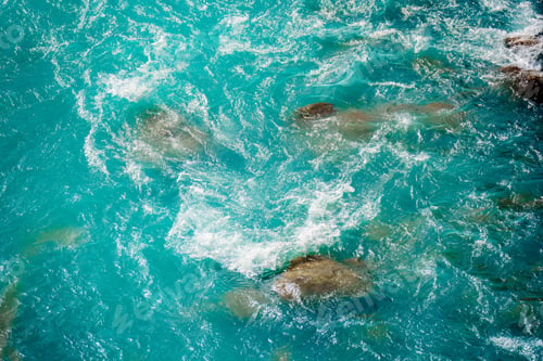 Preview: Rippled turquoise water texture with stone and pebbles riverbed background