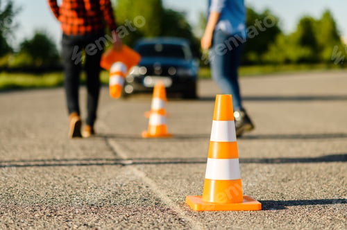 Preview: Instructor and student on road with traffic cones