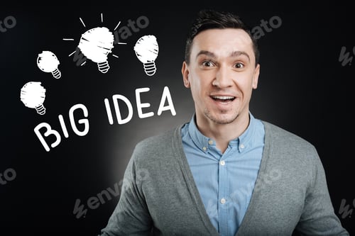 Preview: Big Idea. Emotional Enthusiastic Young Employee Feeling Excited And Smiling Happily While Getting A
