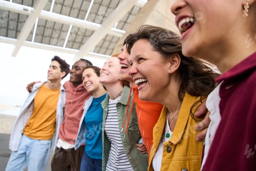 Preview: Photo of multiracial group of friends smiling carefree outdoors. Friendship concept leisure time.
