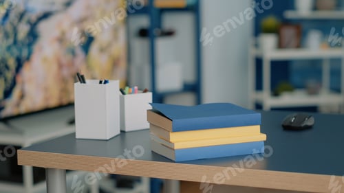 Preview: Nobody at home desk with school supplies and books
