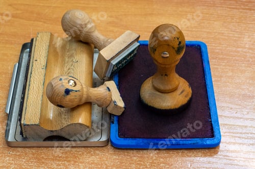 Preview: Closeup shot of wooden stamps on a wooden table