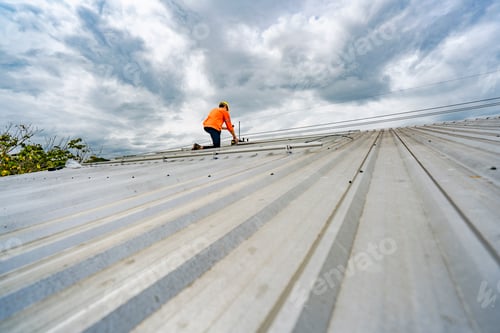 Preview: skilled technician adjusts a solar panel on rooftop