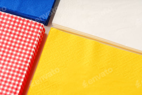 Preview: Colorful square paper napkins background top view