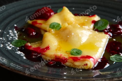 Preview: Pancakes with cherry jam decorated with mint leaves