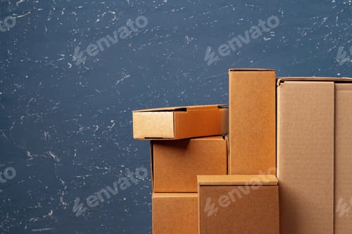 Preview: Group of cardboard boxes against blue background
