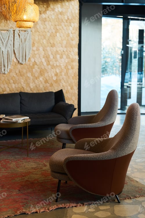 Preview: Part of interior of lounge or openspace office with two comfortable armchairs