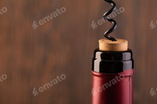 Preview: Corkscrew and bottle of wine