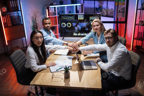 Preview: Diverse brokers stacking their hands after cooperation