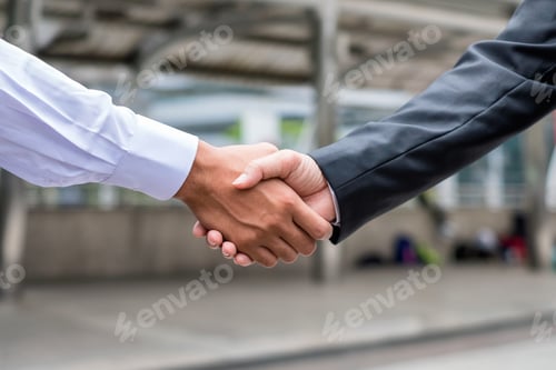 Preview: Handshake agreement of businessman with partnership in urban