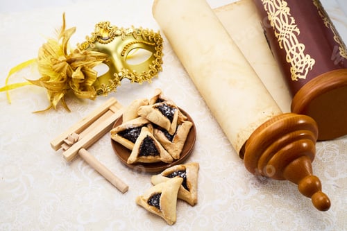 Preview: Purim Celebrations. Golden mask, scroll, gragger, and hamantaschen on decorative background
