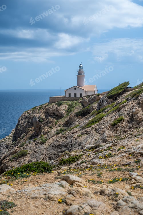 Preview: Lighthouse on Rocky Cliff Overlooking Ocean