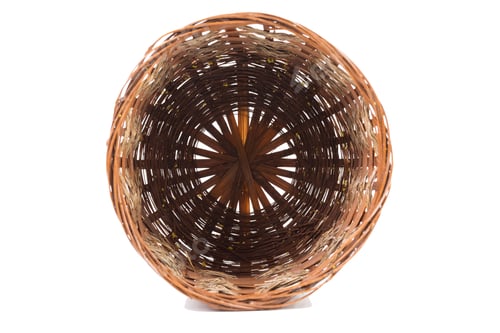 Preview: A basket of willow branches and shavings. Isolated oover white background. Close-up.