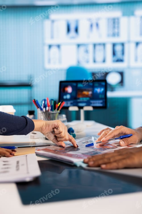 Preview: Physician meeting with a patient to discuss medical test results in a cabinet