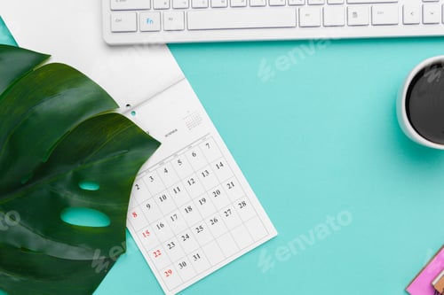 Preview: Top view flat lay of workspace desk styled design office supplies with calendar