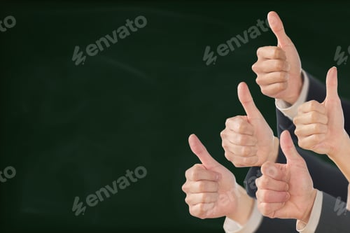 Preview: Business person giving good sign on blackboard background