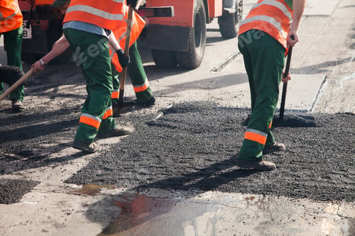 Preview: Workers on Asphalting paver machine during Road street repairing works.