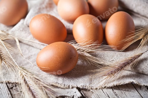 Preview: fresh brown eggs and wheat ears