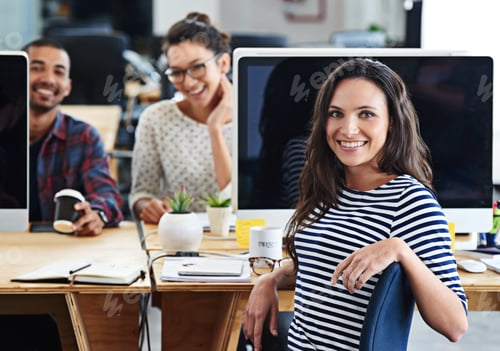 Preview: Make creativity a job. Portrait of a group of young office workers sitting at their computers.