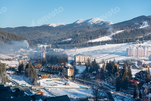 Preview: Top view winter landscape of a little town near mountains