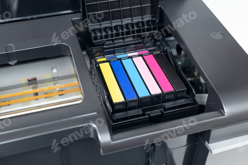 Preview: Close up of a multicolor ink cartridges of a inkjet printer.