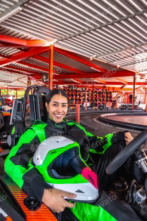 Preview: Smiling woman ready for karting track experience