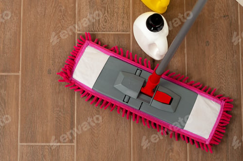 Preview: Top view of a pink mop on wooden floor