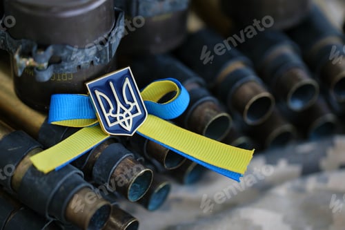 Preview: Ukrainian symbol on machine gun belt lies on ukrainian pixeled military camouflage