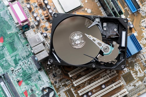Preview: the macro view of thye hdd drive with information data, magnetic disc, electronic board background