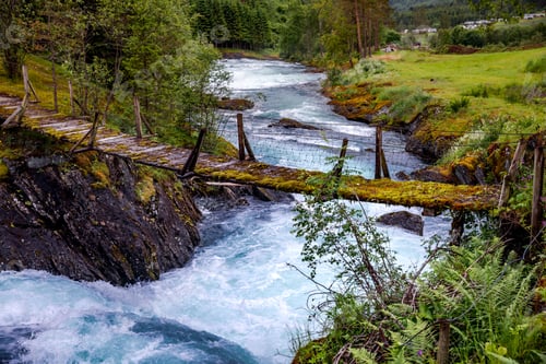 Preview: Suspension bridge over the mountain river, Norway.