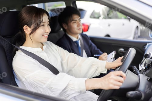Preview: A woman taking a car driving lesson