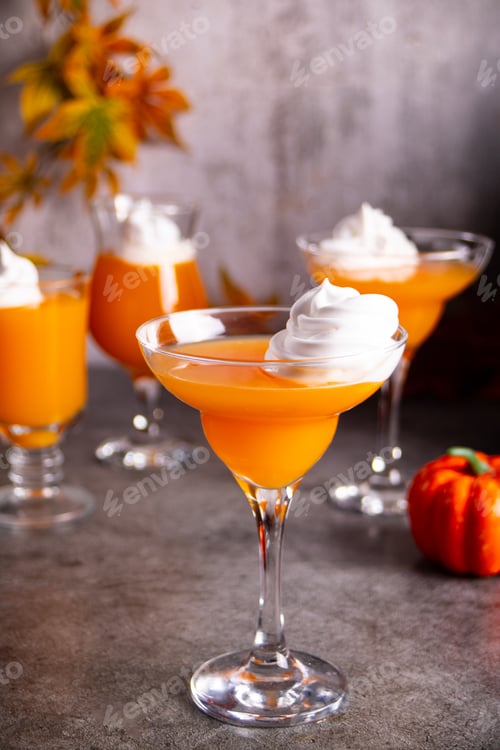 Preview: Pumpkin fall seasonal drink cocktail latte with spices and whipped cream for Thanksgiving