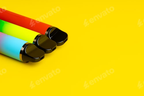 Preview: Colorful disposable electronic cigarettes on yellow background