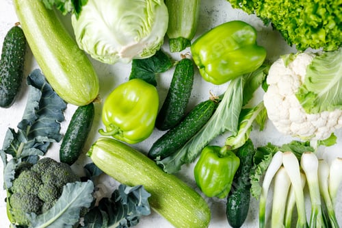Preview: Variety of green vegetables background. Top view of healthy organic food