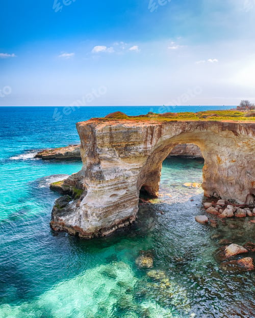 Preview: Picturesque seascape with cliffs, rocky arch at Torre Sant Andrea