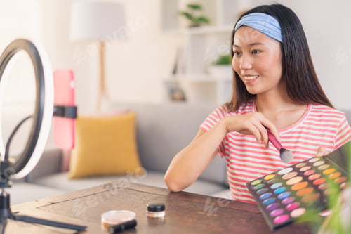 Preview: Young asian woman making an auto-makeup video for her networks