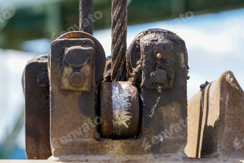 Preview: Closeup shot of a well-greased steel cable on a crane hook