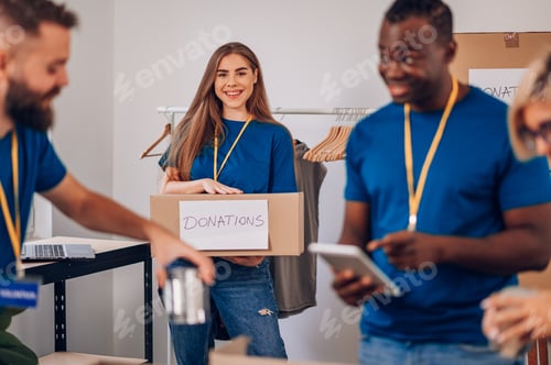 Preview: Portrait of a woman volunteer working in a charity donation center
